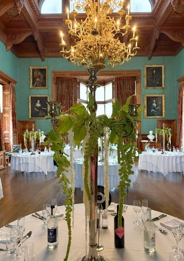 Knowsley hall reception flowers candelabras with hanging green Amaranthus flowers